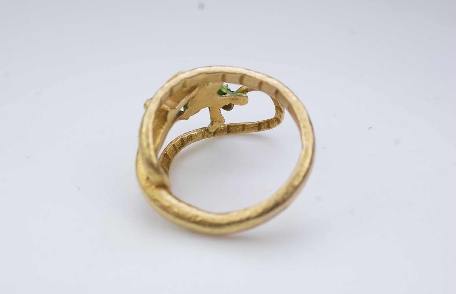 An unusual gold and enamel novelty ring
